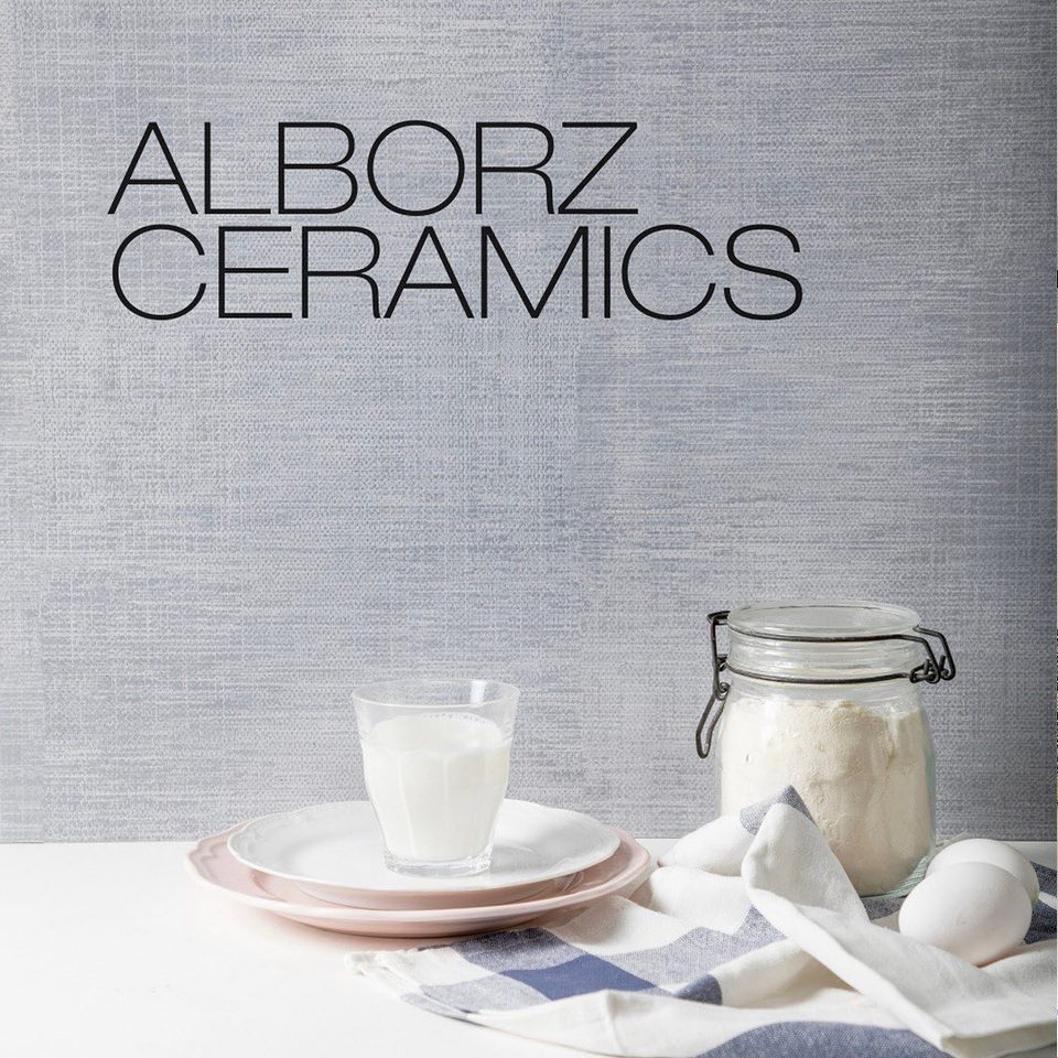 Milk, flour and eggs on a table under the words Alborz Ceramics